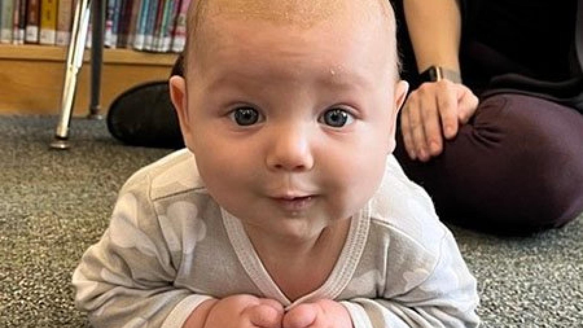 Infant smiling at camera